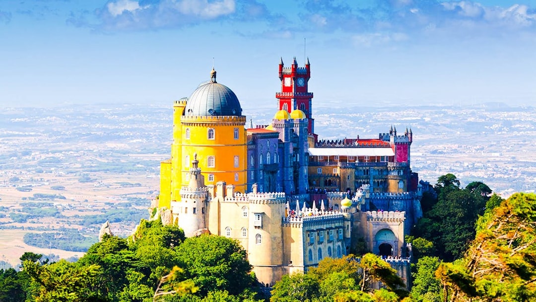 Pena Palace in Sintra, Portugal, with vibrant colors and scenic landscape.