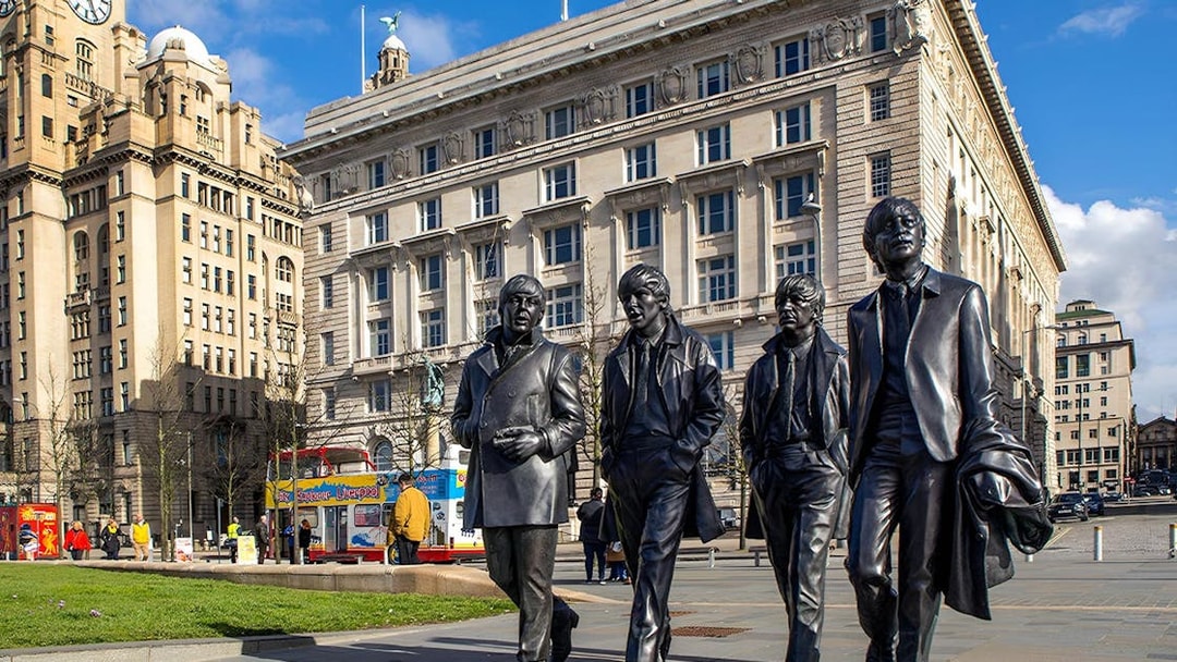 Statues of famous musicians in front of the Royal Liver Building, Liverpool.