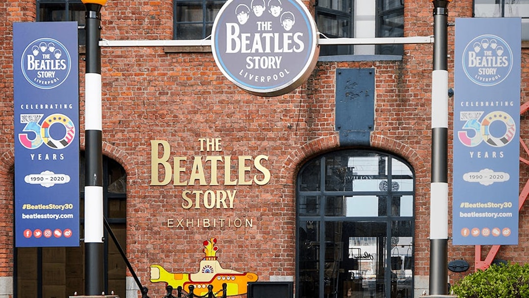 Beatles Story exhibition entrance in Liverpool with anniversary banners.