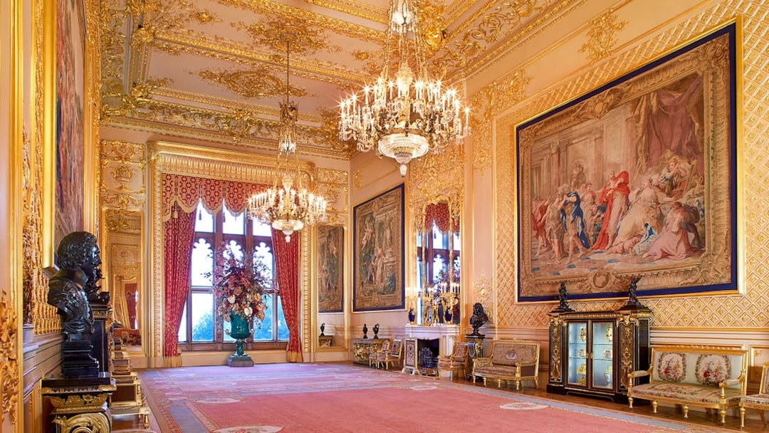 Grand Reception Room at Windsor Castle with chandeliers and ornate tapestries.
