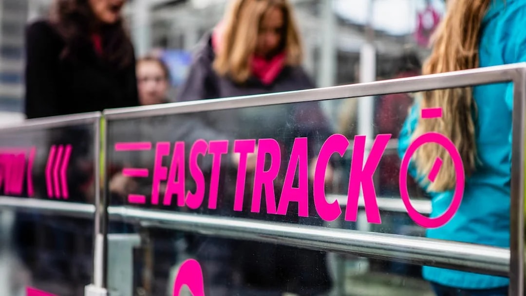 Fast track entrance for London Eye tickets with people in line.