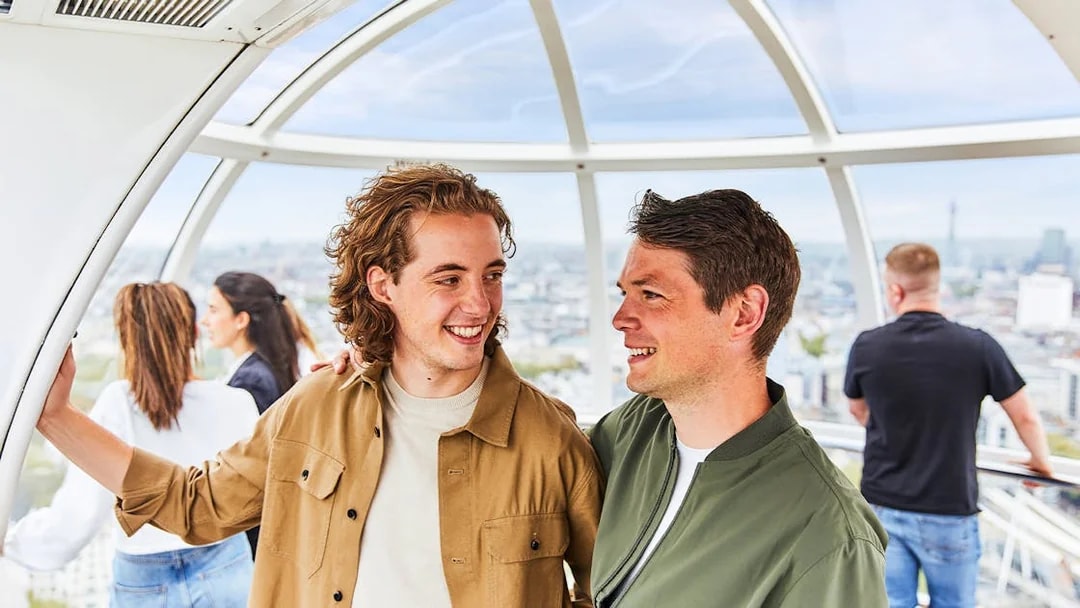 People enjoying the view from a London Eye capsule.