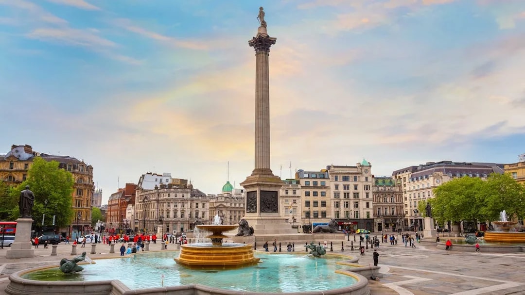 Trafalgar Square in London with Nelson's Column and fountains.