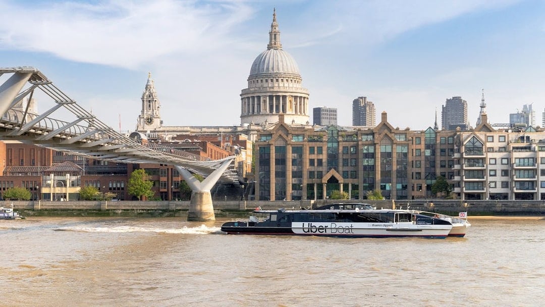 Uber Boat on Thames River near Millennium Bridge, London.