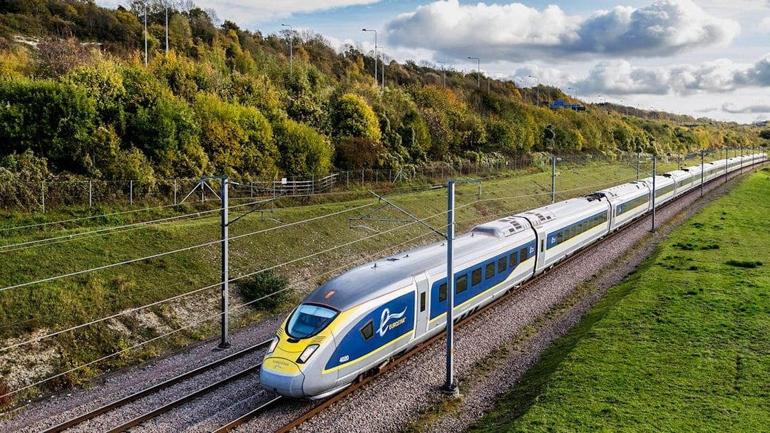 Eurostar train traveling through countryside, Eurail Pass experience.