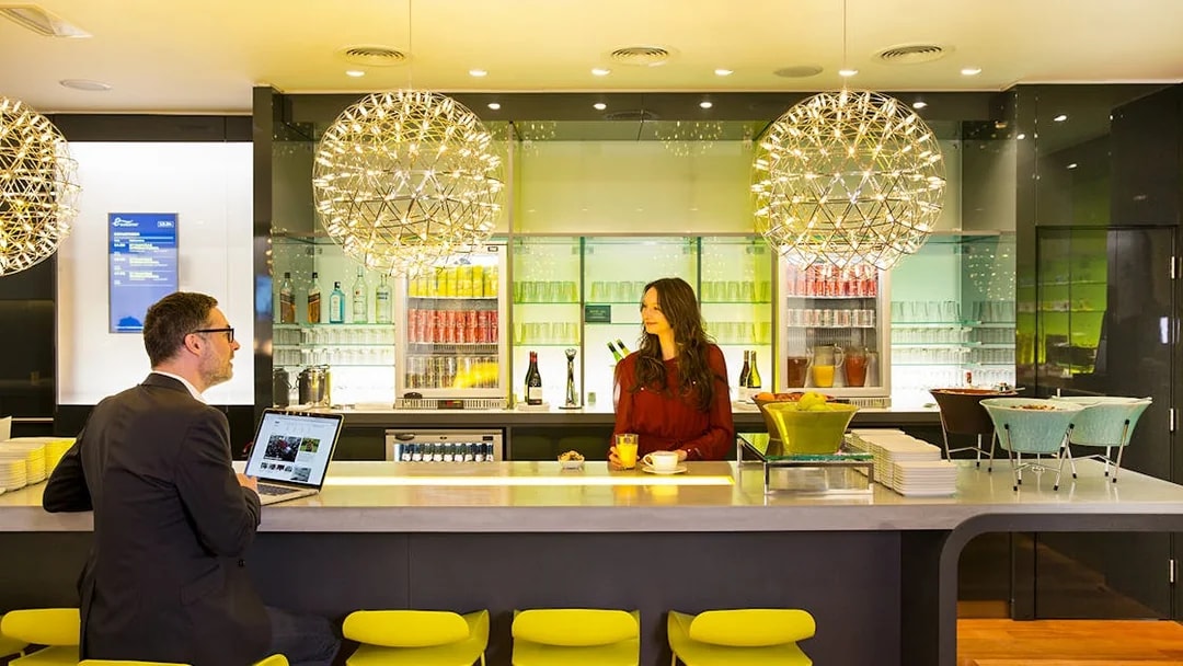 Eurostar Business Premier Lounge in Brussels with guests at the bar.
