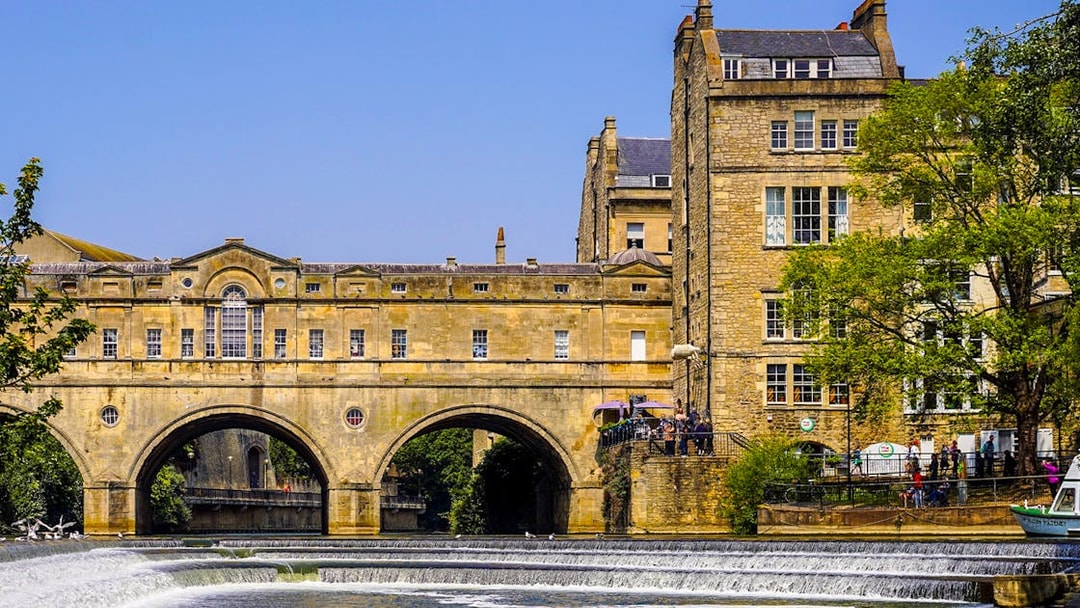 Pulteney Bridge over River Avon in Bath, part of Stonehenge, Windsor, and Bath tour.