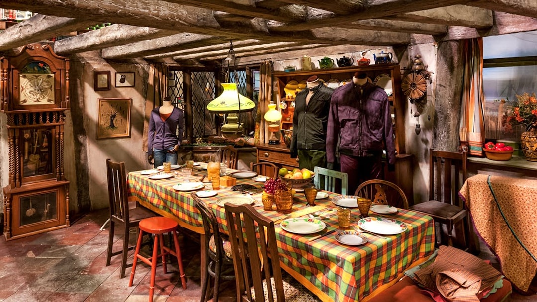 Weasley kitchen exhibit with table setting, part of Harry Potter London tour.