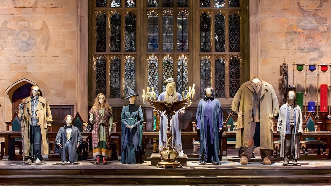 Costumes from Harry Potter characters displayed at the London tour exhibit.