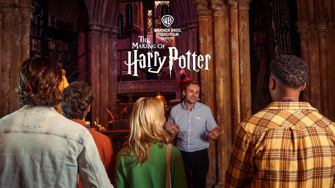 Guide leading a group at Harry Potter Warner Bros Studio Tour London.