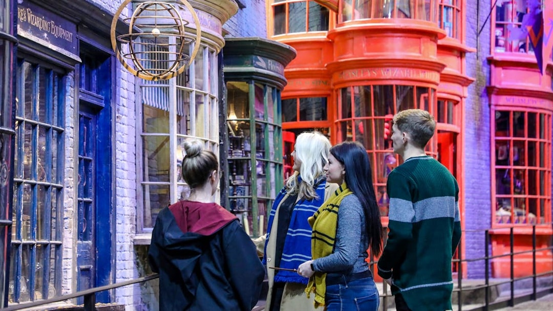 Visitors exploring Diagon Alley during a small group guided tour of Harry Potter in London.