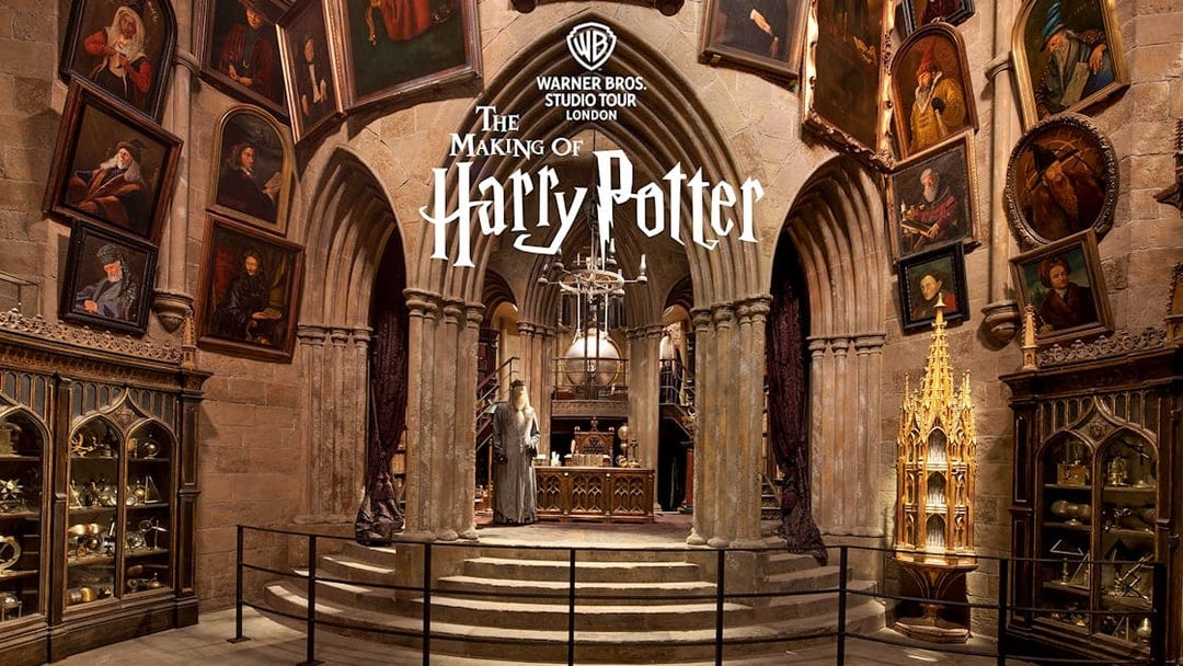 Dumbledore's office set at Warner Bros Studio Tour London, featuring portraits and magical artifacts.
