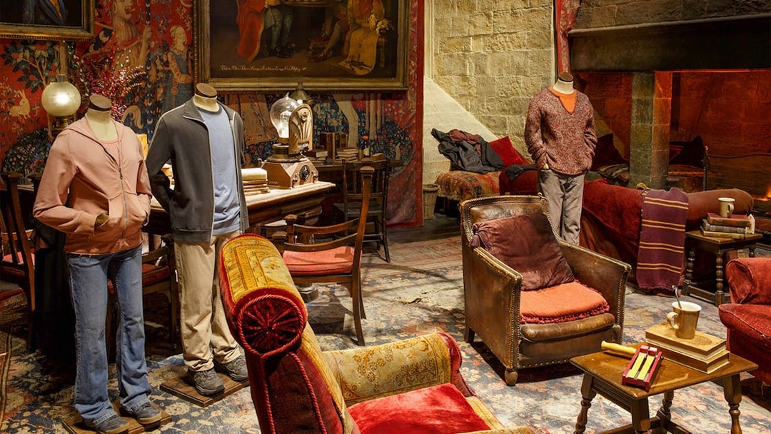 Gryffindor common room set with costumes from The Making of Harry Potter tour.