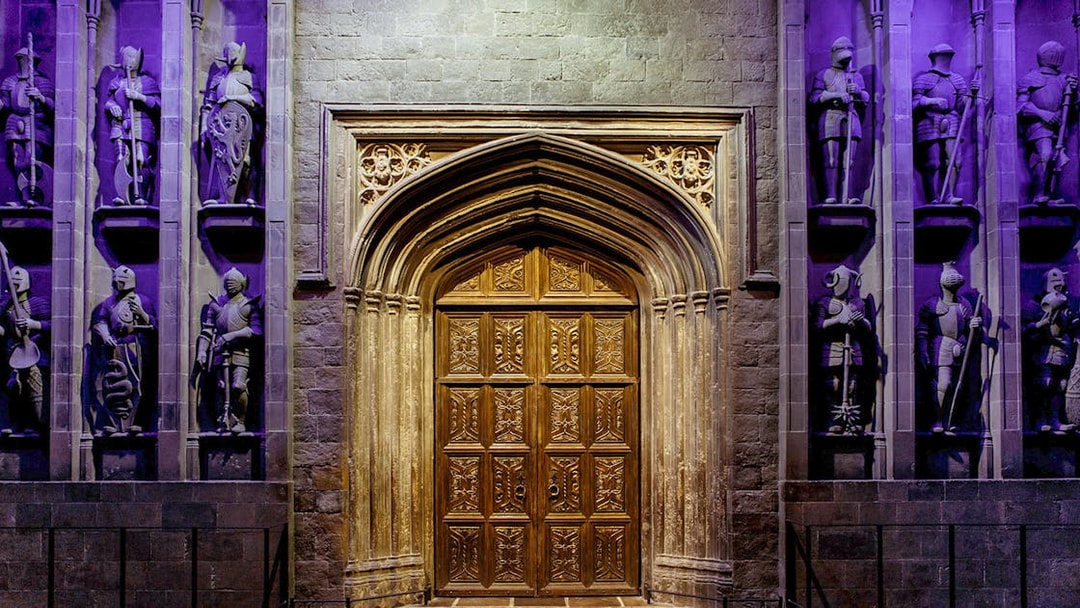Entrance to the Great Hall at The Making of Harry Potter tour, featuring ornate wooden doors.