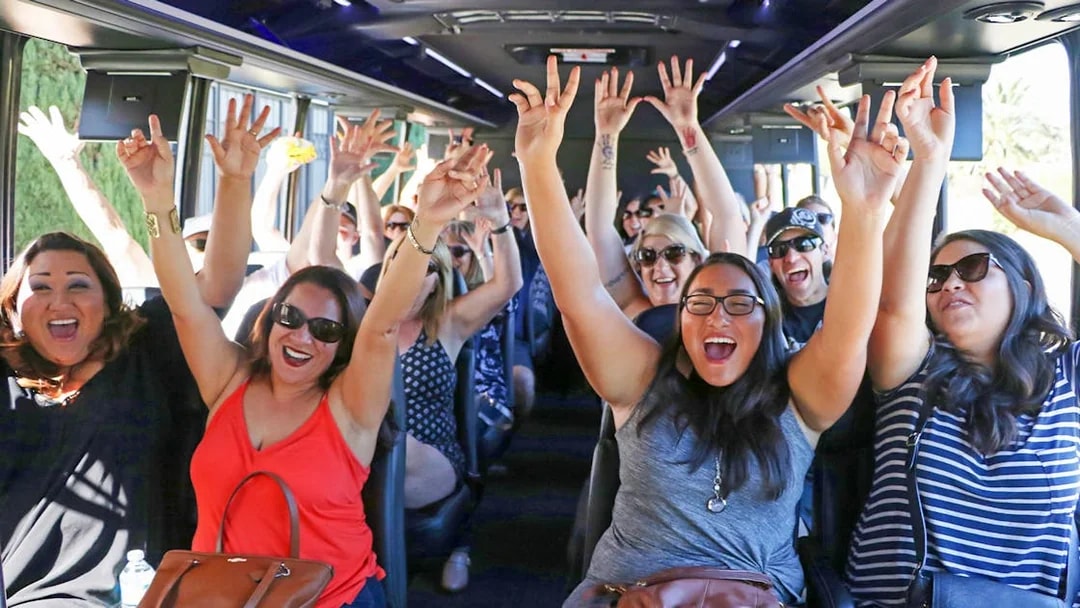 Tourists enjoying the TMZ Hollywood Tour bus experience.