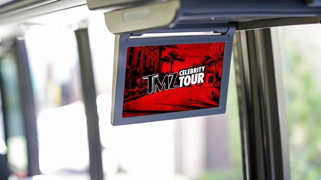 TMZ Hollywood Tour screen inside bus showing celebrity hotspots.