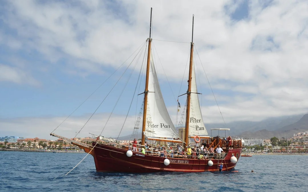 Tourists on Peter Pan Pirate boat for whale and dolphin watching in Tenerife.