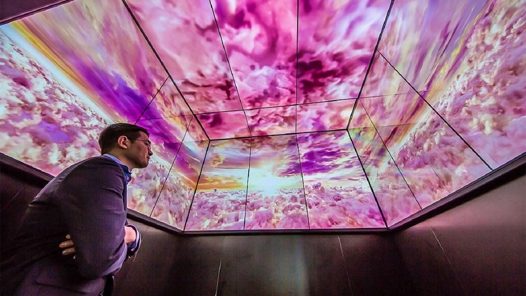 Man viewing digital sky display at Lotte World Tower Seoul Sky.