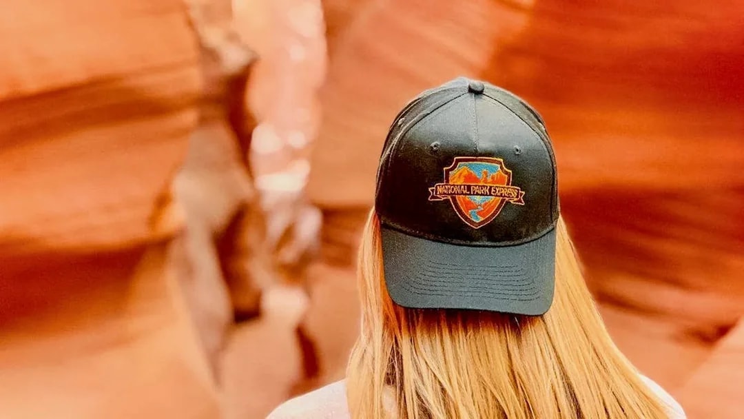 Visitor wearing a National Park Express cap in Antelope Canyon.