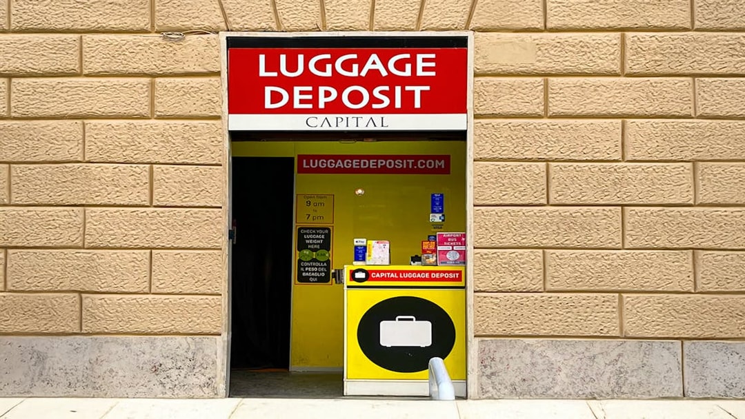 Luggage deposit service entrance in Rome with signage and operating hours.