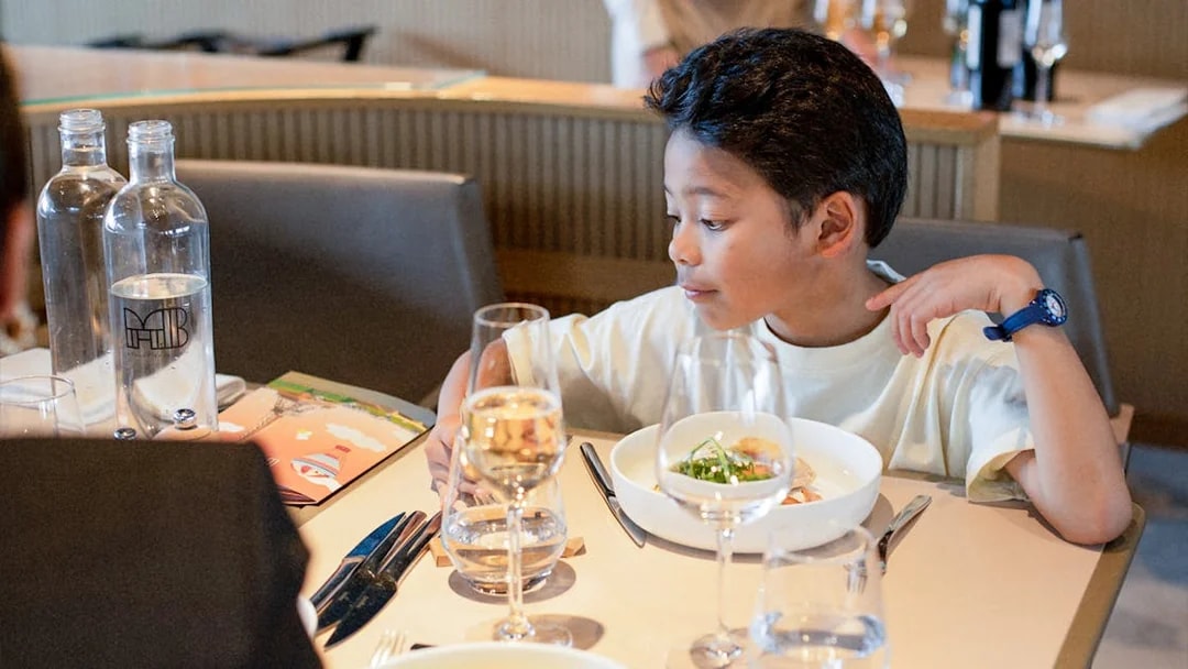 Lunch setting at Madame Brasserie, Eiffel Tower, with a child dining.