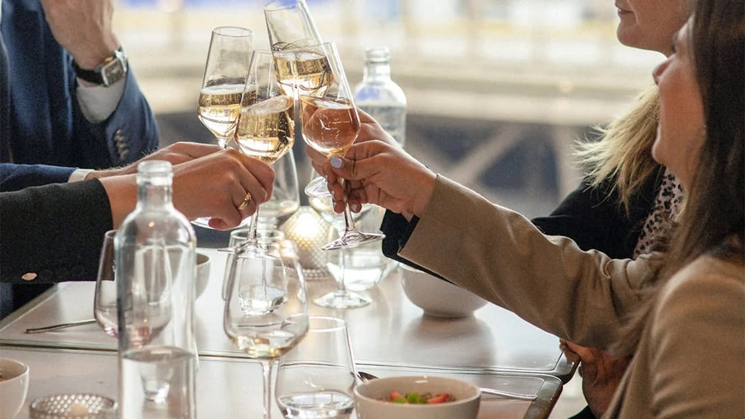Lunch toast at Eiffel Tower's Madame Brasserie with champagne glasses.