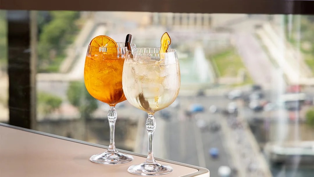 Cocktails on a table with a view from Madame Brasserie, Eiffel Tower, Paris.