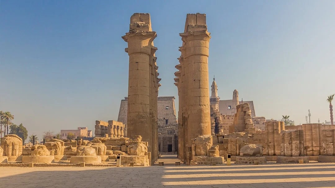 Luxor Temple entrance with ancient columns under a clear sky, Egypt.
