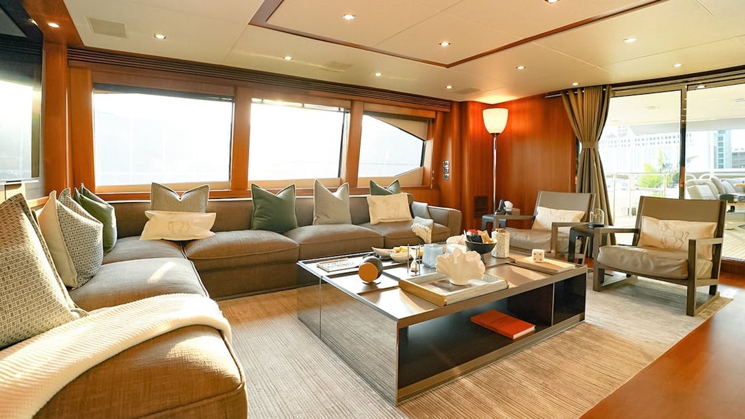 Luxurious Sunseeker superyacht interior with plush seating and elegant decor.