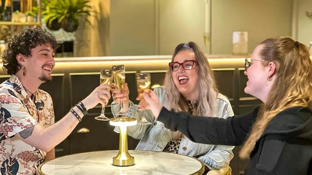 Guests enjoying champagne at Madame Tussauds London Champagne Bar.