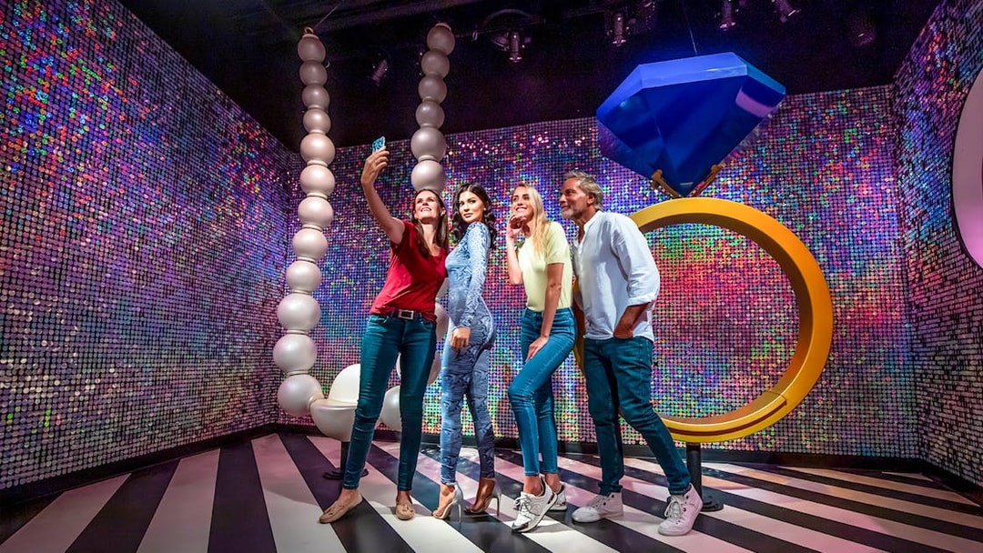 Visitors taking a selfie with Kylie Jenner wax figure at Madame Tussauds Dubai.