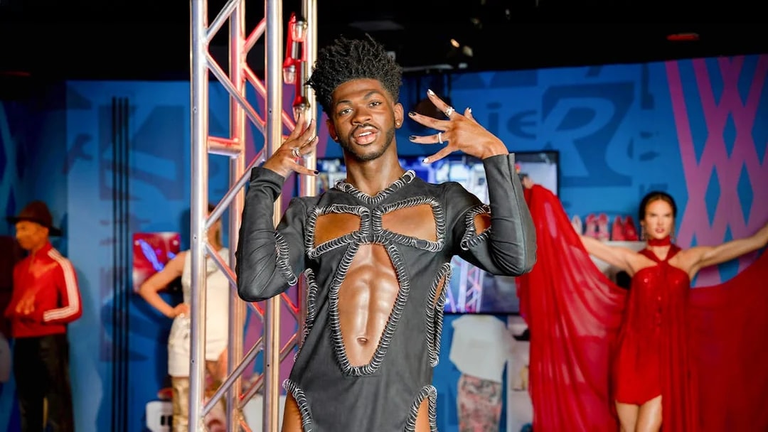 Wax figure of Lil Nas X at Madame Tussauds, New York, in a unique outfit.