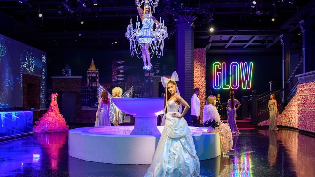 Wax figures of music artists at Madame Tussauds New York, featuring Ariana Grande and Sia.