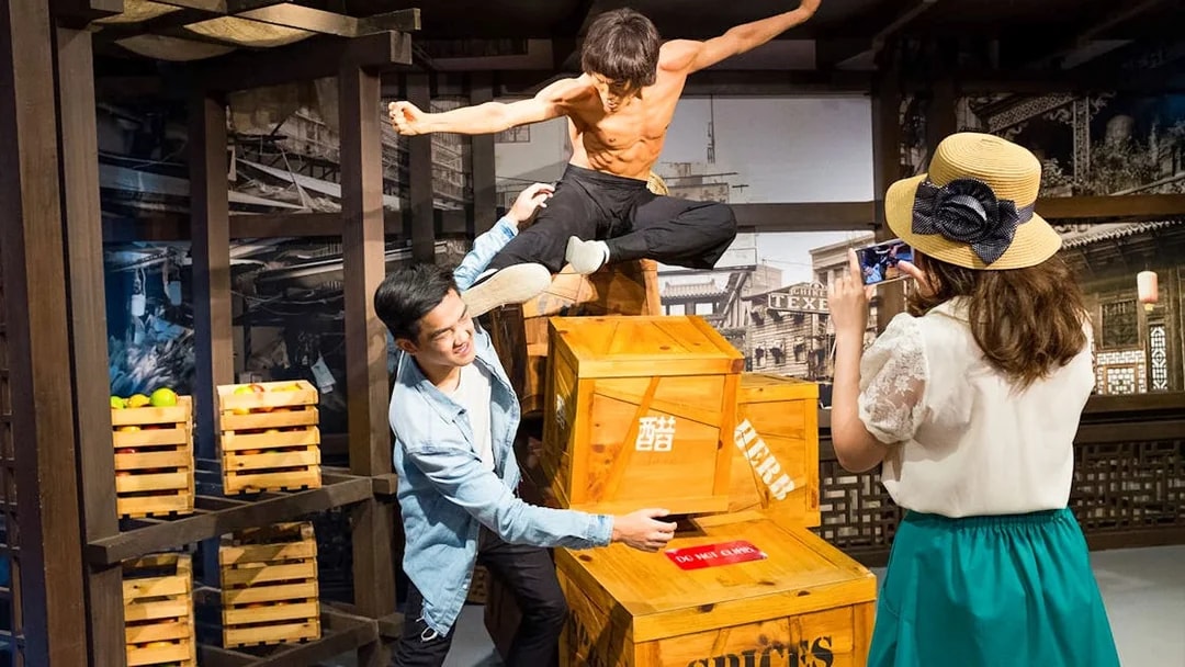 Wax figure of martial artist in action at Madame Tussauds Singapore.