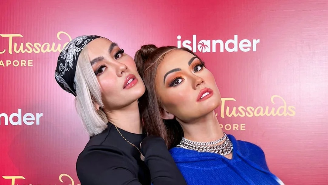 Wax figures at Madame Tussauds Singapore exhibit.