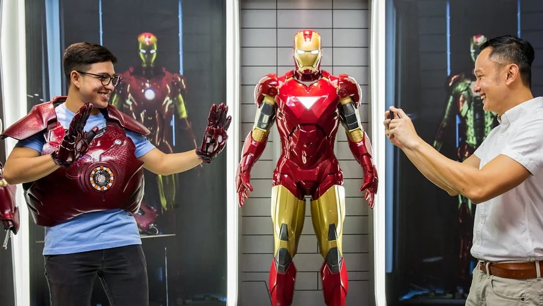 Visitor posing with Iron Man figure at Madame Tussauds Singapore.