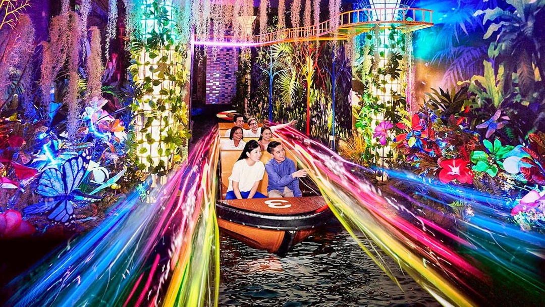 Boat ride through vibrant lights and foliage at Madame Tussauds Singapore.