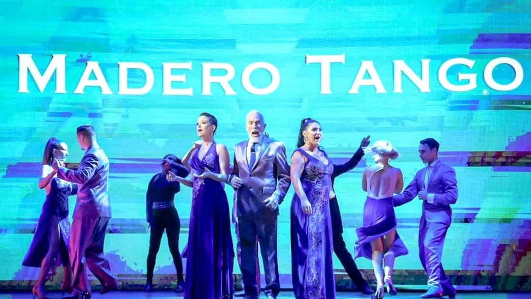 Performers dancing on stage at Madero Tango Show in Buenos Aires.