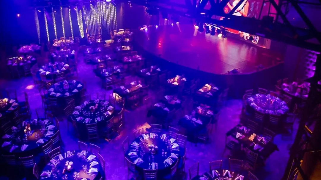 Dimly lit dining area set for Madero Tango Show in Buenos Aires.