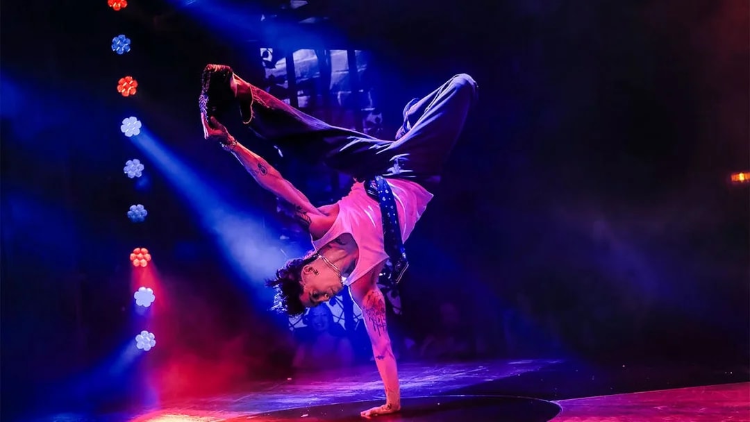 Performer doing a handstand at Magic Mike Live show.