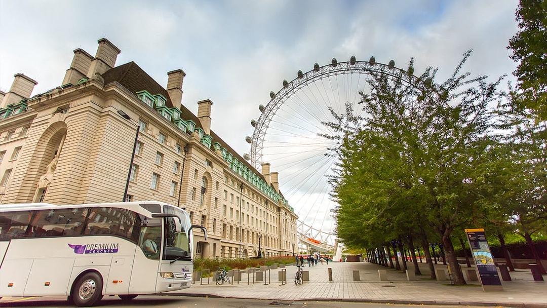 London Eye and County Hall near tour bus on Magic of London Tour.