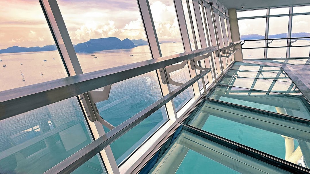 View from Maha Tower's glass floor overlooking the sea in Malaysia.
