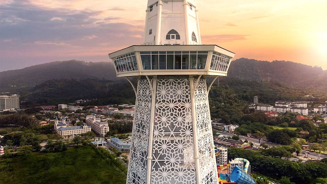 Maha Tower in Malaysia with intricate design and panoramic view of surrounding landscape.