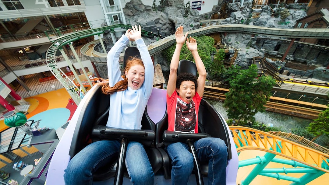 Guests enjoying a roller coaster ride at Nickelodeon Universe, Mall of America.