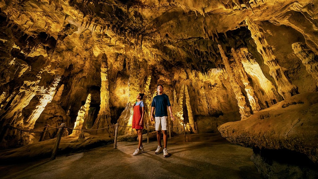 Visitors exploring stalactites and stalagmites in The Cavern, Drunken Forest.