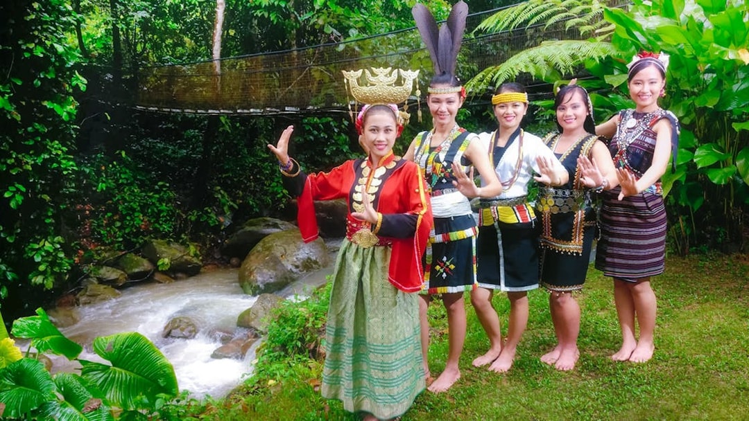 Traditional dancers in cultural attire at Mari Mari Cultural Village, Sabah, Malaysia.