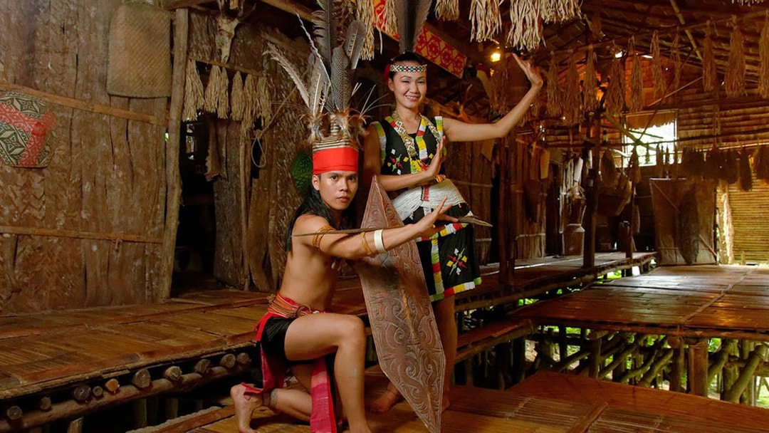 Traditional dancers performing at Mari Mari Cultural Village in Sabah, Malaysia.