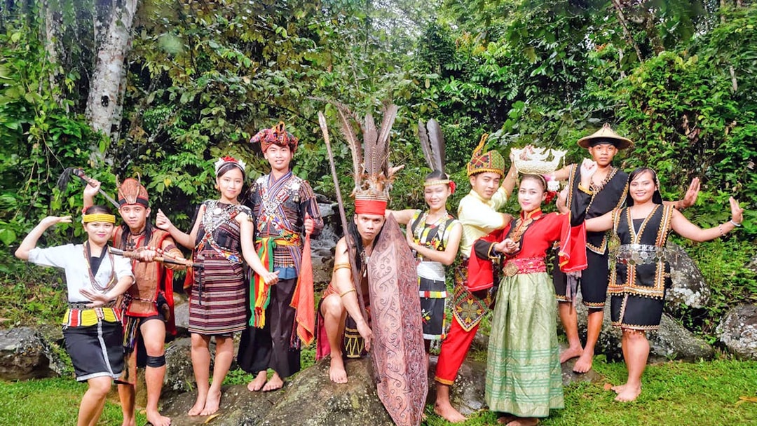 Traditional dancers in cultural attire at Mari Mari Cultural Village tour.