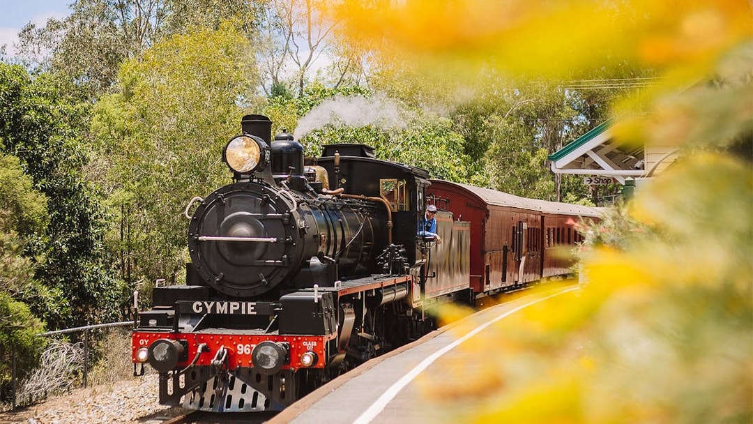 Steam train departing Gympie station on the Mary Valley Rattler experience.