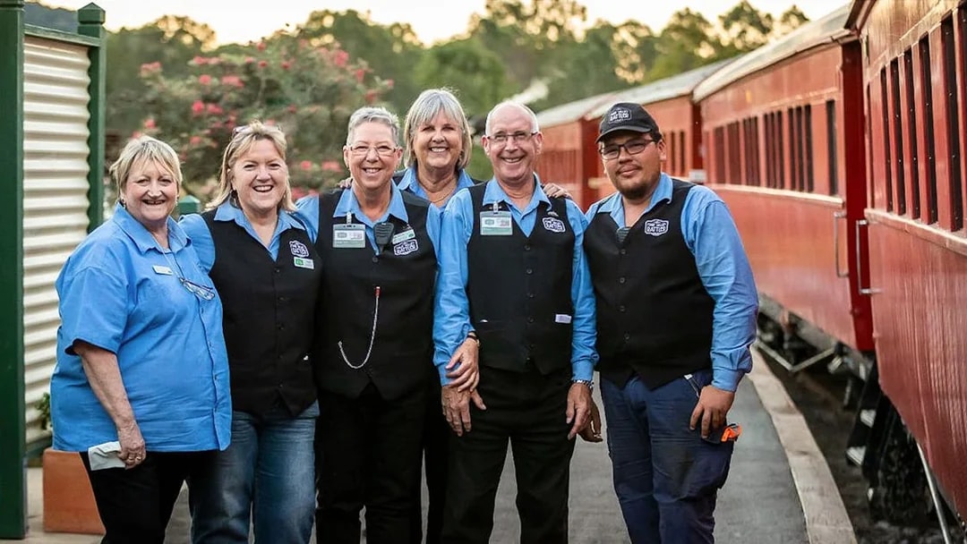 Mary Valley Rattler staff standing by the train in Gympie.